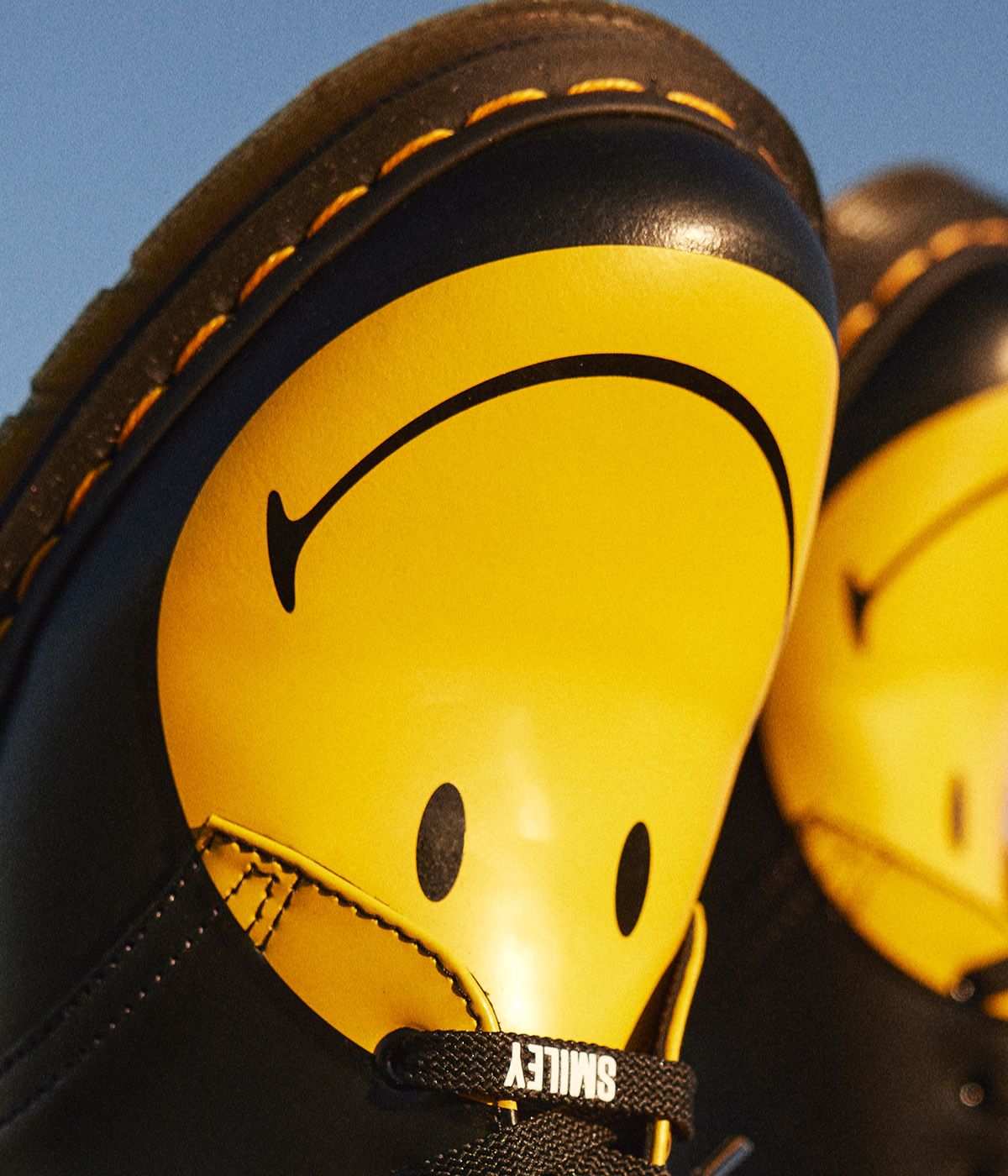Dr martens smiley face yellow sale